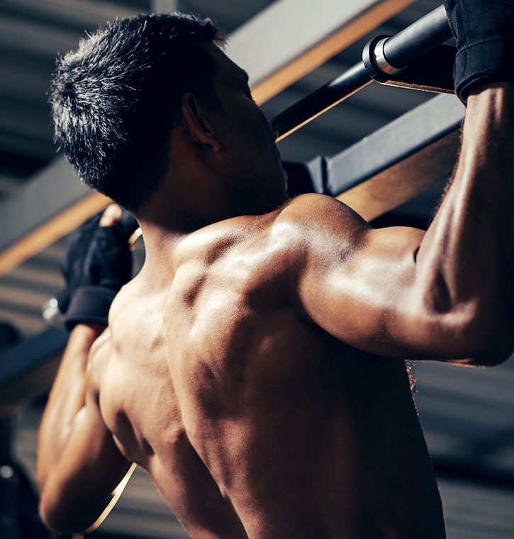 Muscular Guy doing Pull Ups