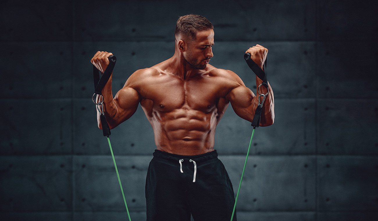 Muscular Guy Doing Cable Pull Ups